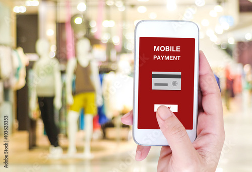 Wallpaper Mural Mobile payment concept on smart phone screen over blur store Torontodigital.ca