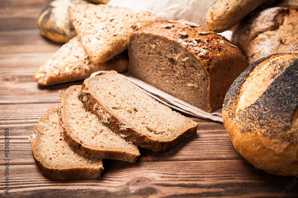 Bread assortment on wooden surface Bread assortment on wooden surface
