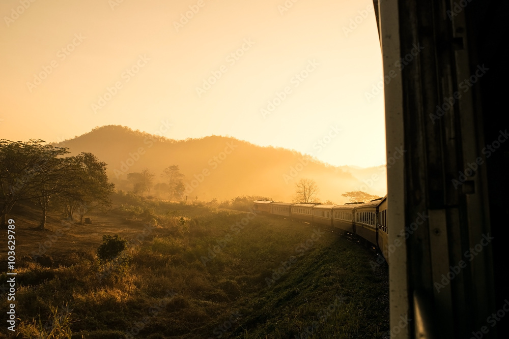 Obraz premium Look out the window Train in morning sunlight