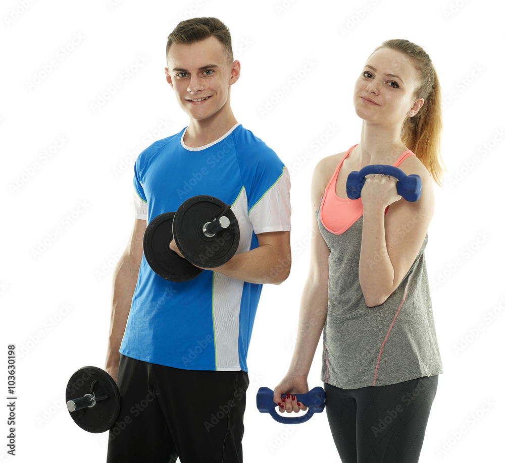 Teenagers working out with dumbbells Teenagers working out with dumbbells