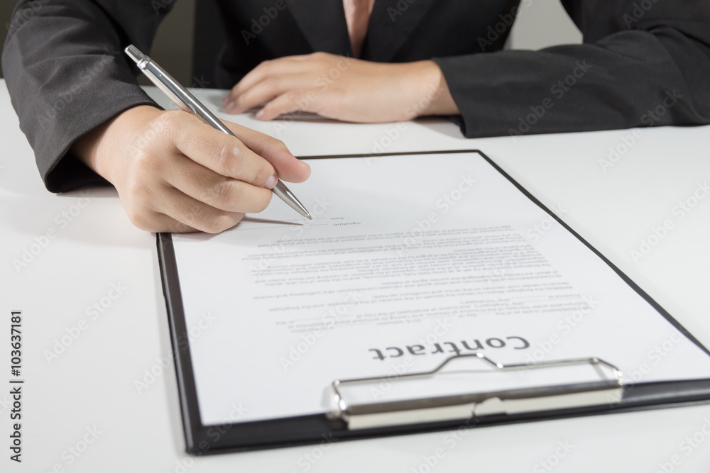 Business woman signing contract document form Business woman signing contract document form