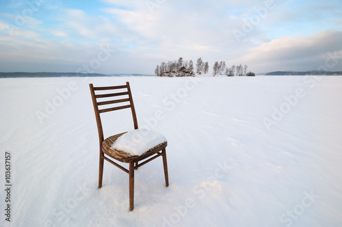 Vintage chair in the middle of a frozen lake