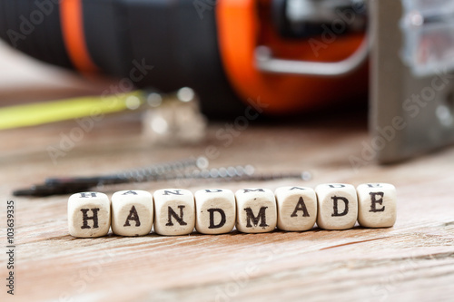 Word HANDMADE written on a wooden block. © Alex Ishchenko
