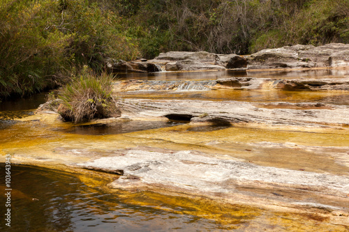 Yellow water river on quartzite rocks