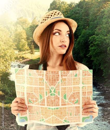 Traveler with map on nature...