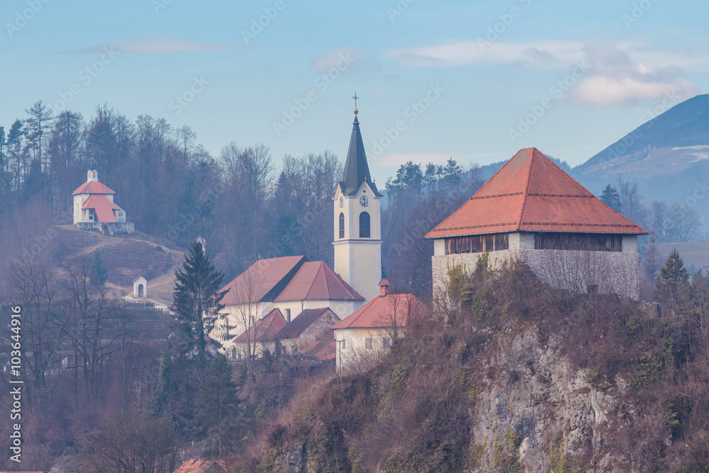 Kamnik, Slovenia - January 25, 2016. Architectural composition of Little Castle, Church of St. Joseph and main town cemetery with Calvary chapels.