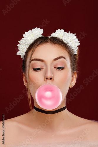 Beauty surprised fashion funny model girl with pink bubble of chewing gum. Expressing positive emotions, smile. Beautiful woman