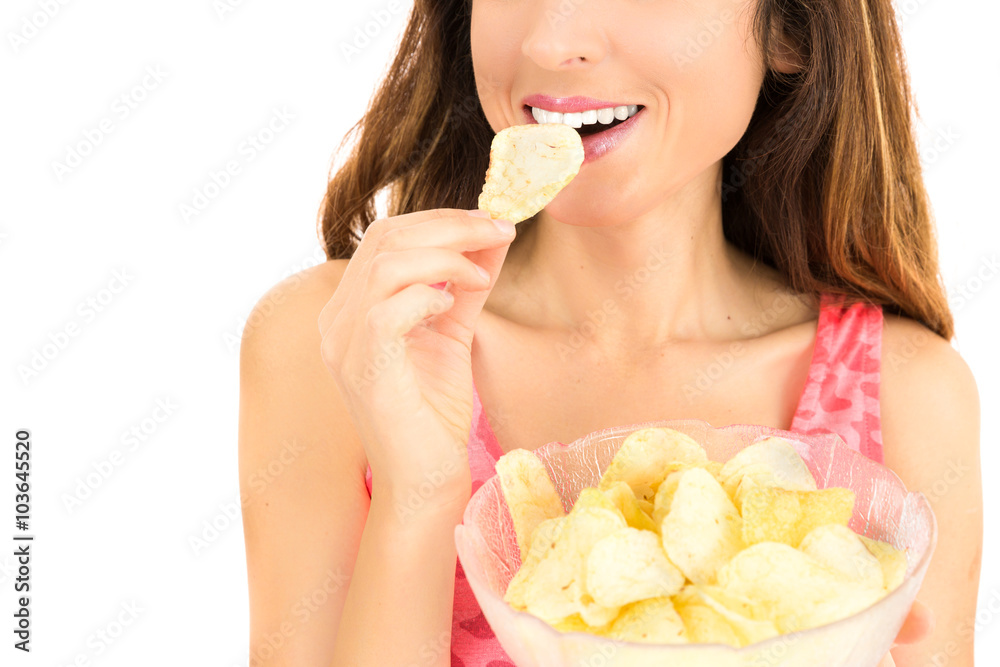 Caucasian woman eating potato chips for snack Caucasian woman eating potato chips for snack