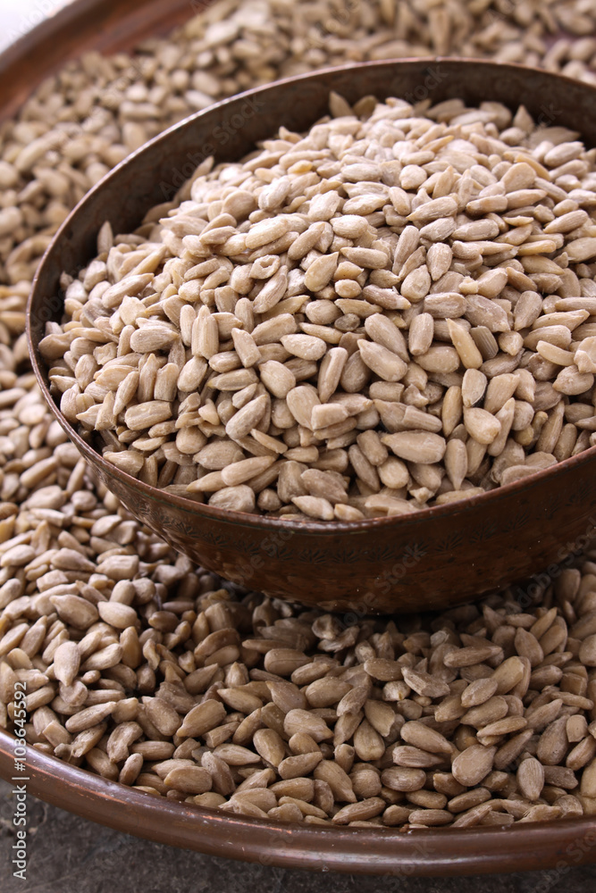Fototapeta premium hulled sunflower seeds in dish