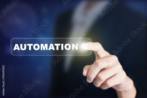 Businessman pressing a automation concept button. Can be used in advertising.