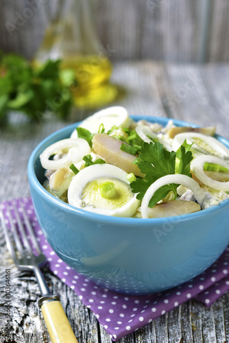 Potato salad with salted herring,marinated onion and eggs.