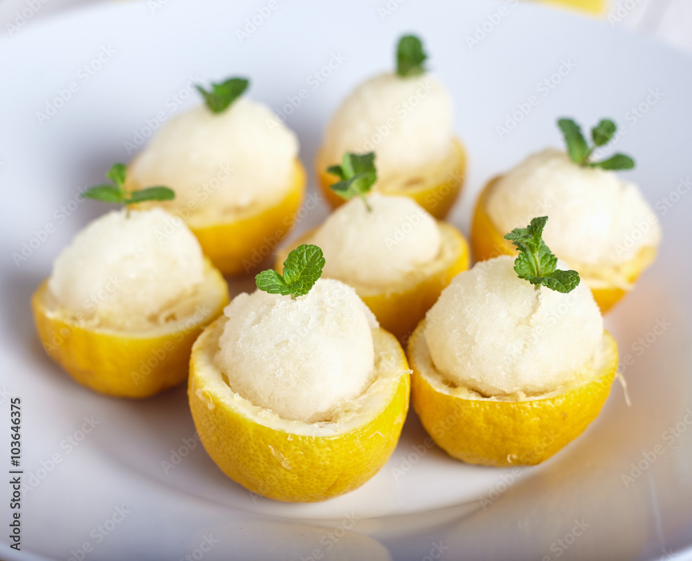 Lemon sorbet or ice cream inside fresh lemons Lemon sorbet or ice cream inside fresh lemons