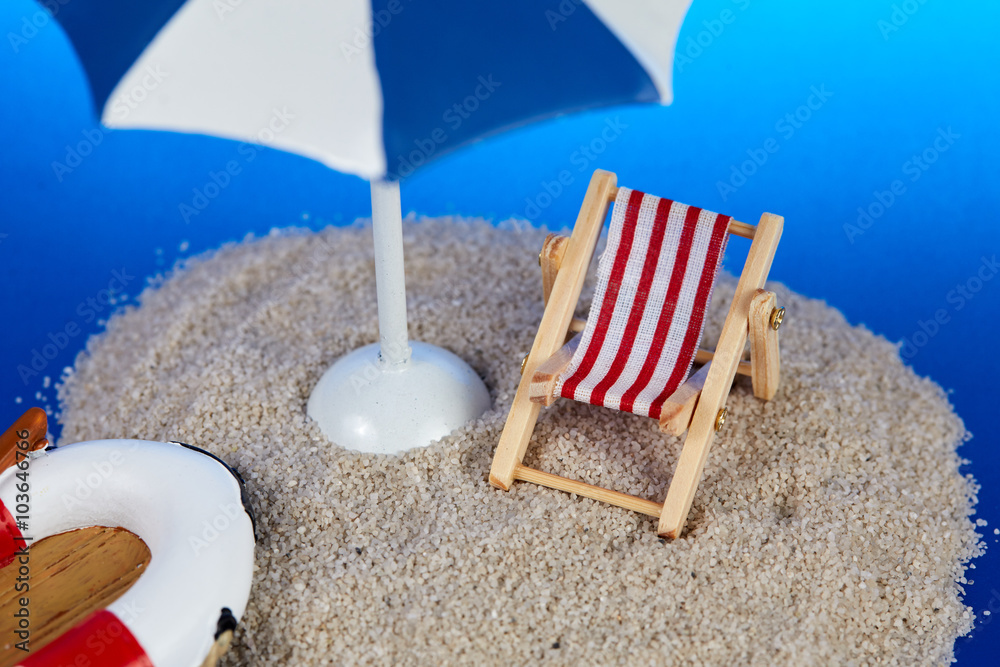 Island with toy deckchair and parasol Island with toy deckchair and parasol