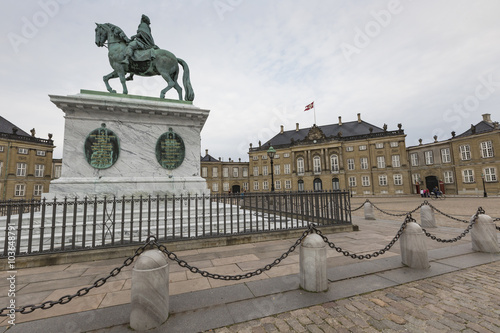 COPENHAGEN, DENMARK -SEPTEMBER 8: Castle Amalienborg with statue photo