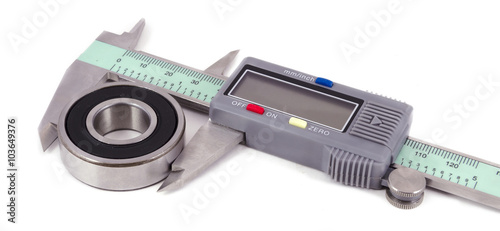 Bearing and electronic caliper on a white background