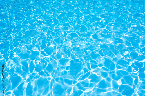 Water surface in swimming pool with sun reflection