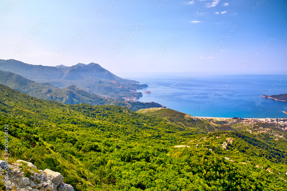 Morning beach with sea and mountain views. Montenegro