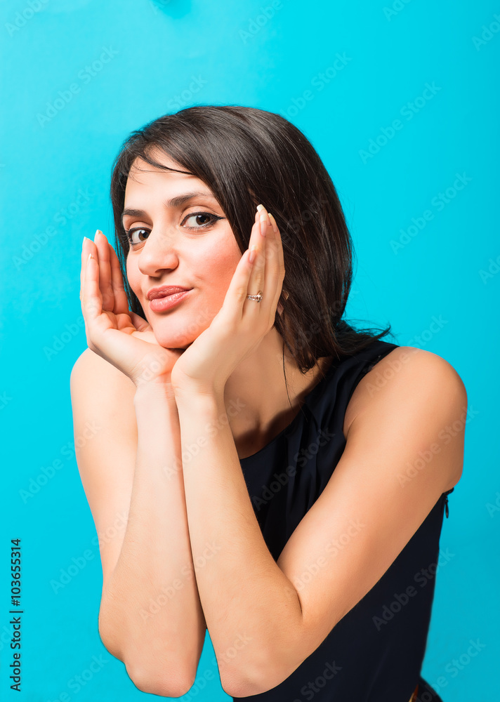 young beautiful woman on a blue background young beautiful woman on a blue background
