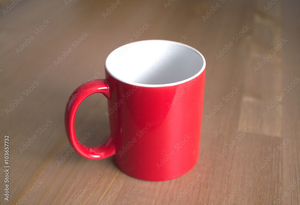 Obraz premium Empty red tea or coffee cups from ceramics on brown wooden background closeup