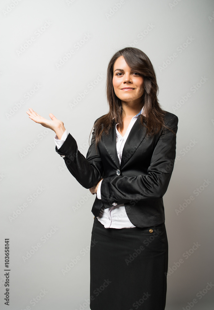 Young beautiful business woman presenting Young beautiful business woman presenting