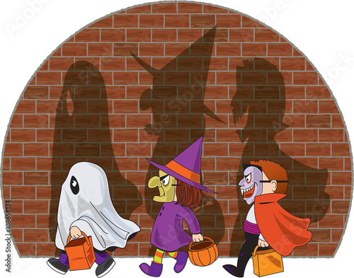 Three trick-or-treating kids cast shadows on brick wall
