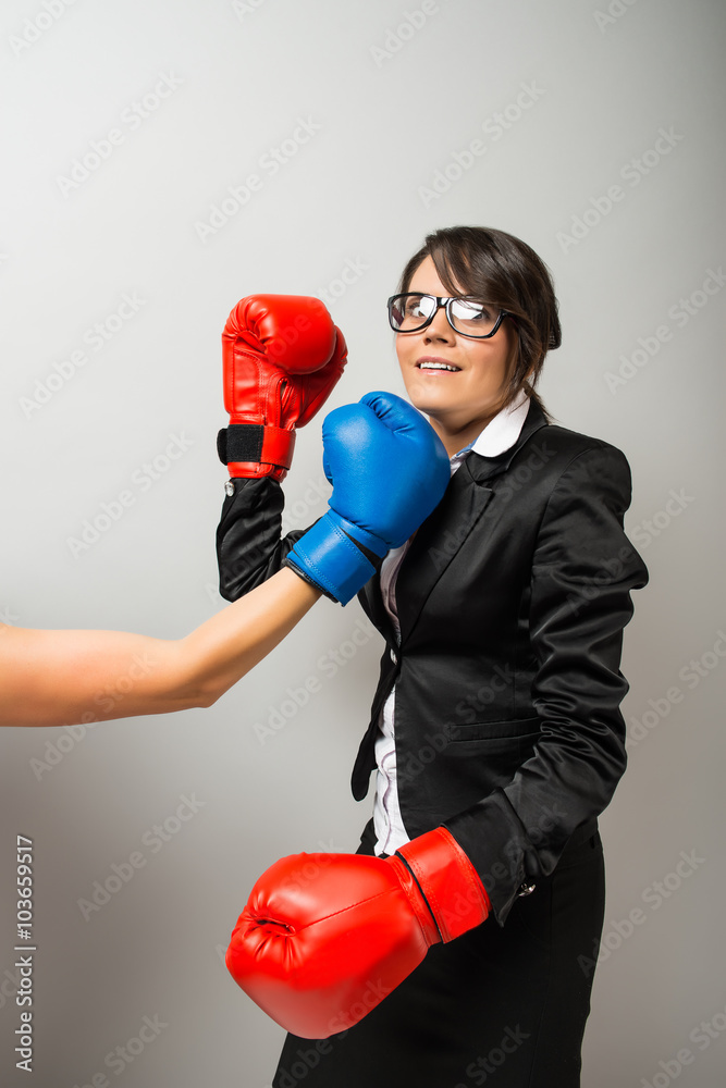 Business women with boxing gloves Business women with boxing gloves