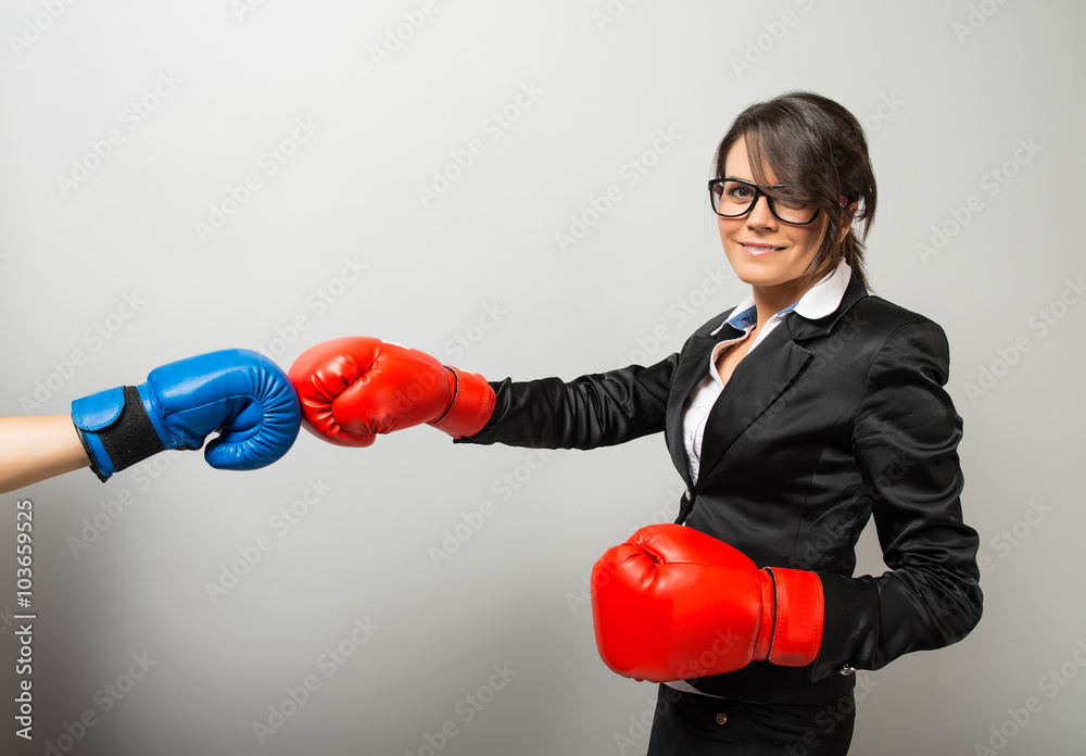 Business women with boxing gloves Business women with boxing gloves