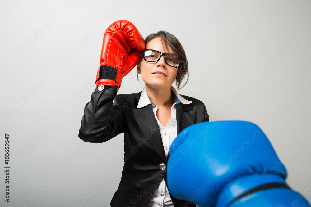 Business women with boxing gloves Business women with boxing gloves