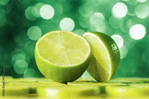 Cut lime against green defocused lights