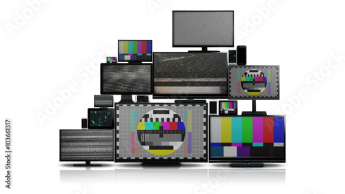 Many different types of screens. TVs, computer monitors, smartphones and tablets. They laid on each other in a pile isolated on a white background. They are all with no signal.