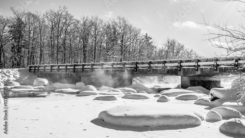 Photography Fog rises from moving water beneath a bridge into sub-zero skies over the West fork of the Chippewa River in northern Wisconsin