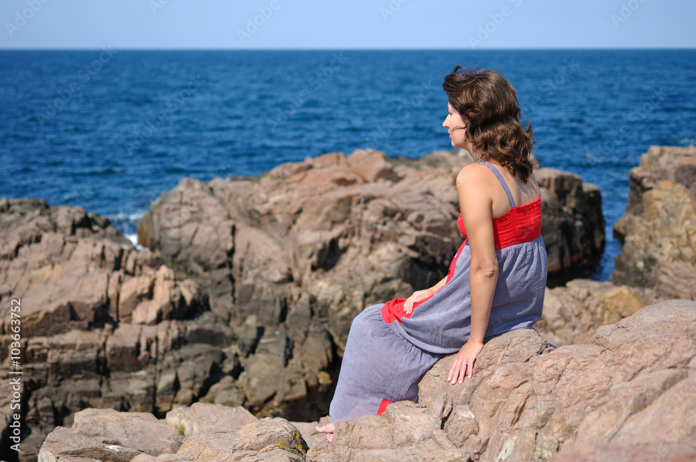 Lonely woman on seacoast Lonely woman on seacoast