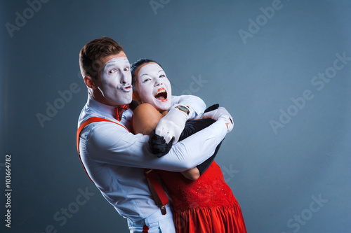  two funny mimes isolated on gray background