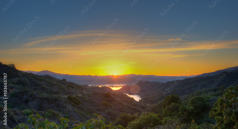 Panoramic view of sun just about to peek out over Lake Casitas.