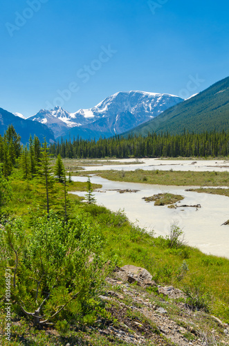 Beautiful river over majestic Rocky Mountains in Alberta, Canada.
