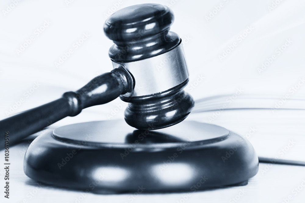 Wooden judges gavel on able, close up. Retro stylization Wooden judges gavel on able, close up. Retro stylization