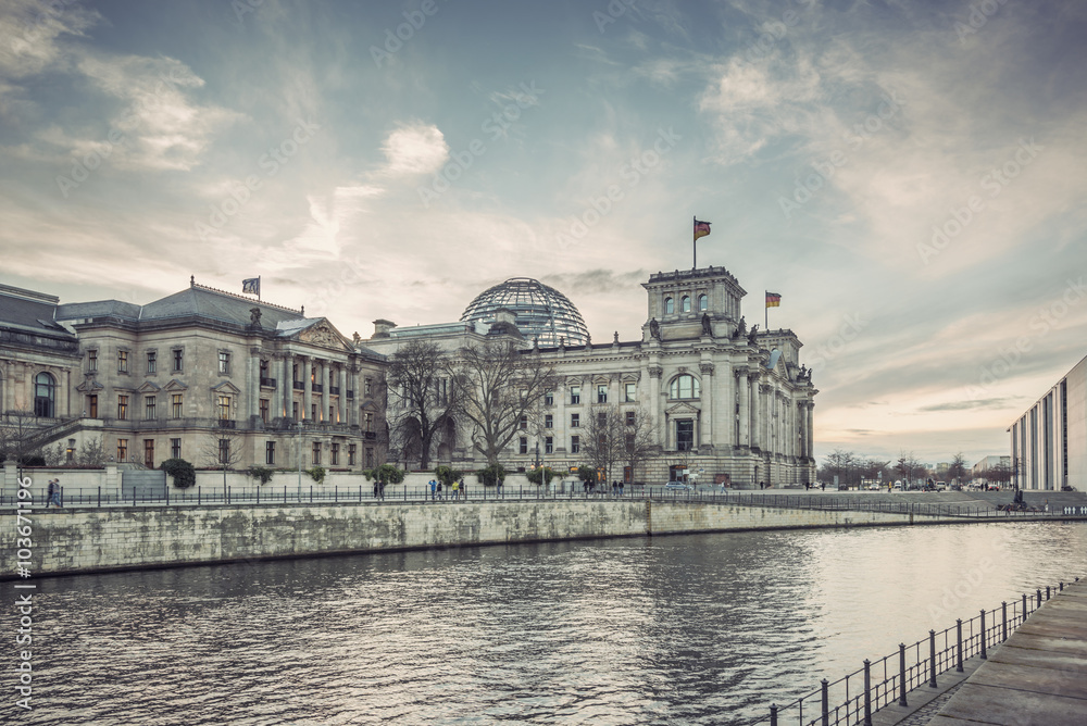 Reichstag building (seat of German parliament, Bundestag) on river Spree, Berlin Government District, Germany, Europe, Vintage filtered style

