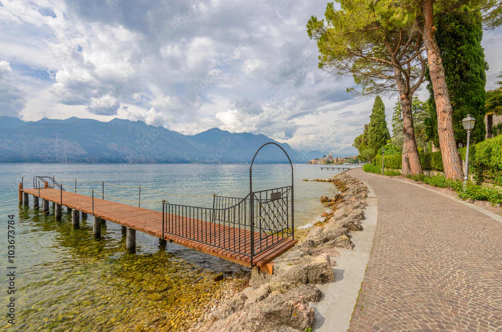 Walkpath along beautiful peaceful lake Garda, Italy