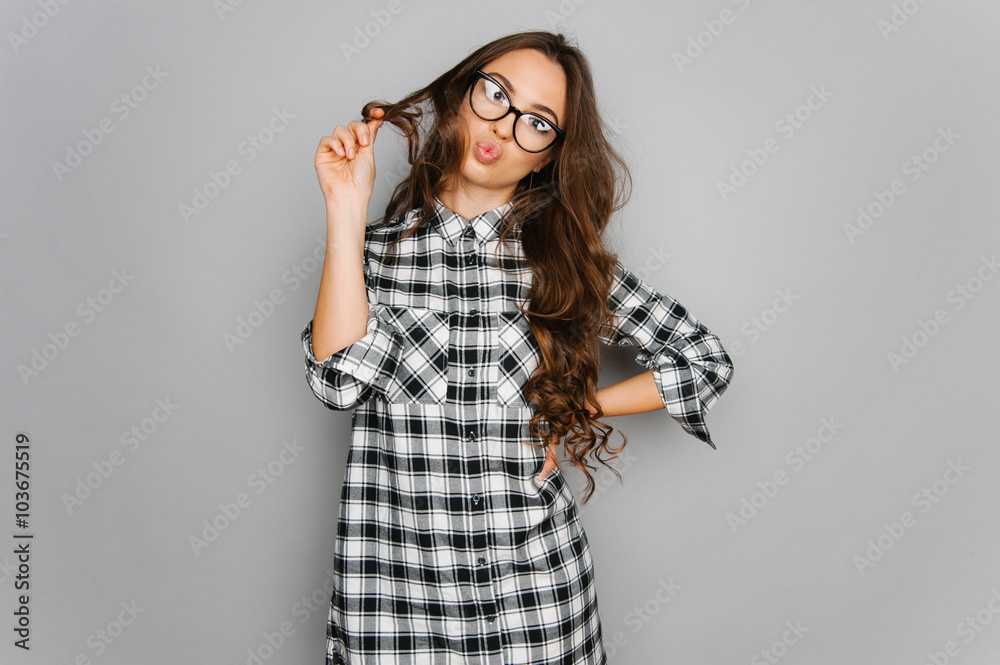 Portrait of cute teen girl wearing stylish shirt isolated on gray background fashion for teenagers Portrait of cute teen girl wearing stylish shirt isolated on gray background fashion for teenagers