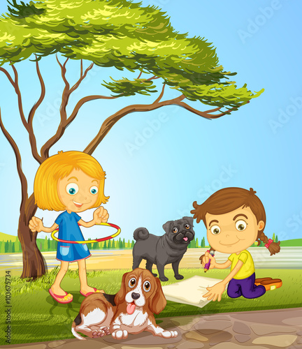 Two girls and two dogs at the park