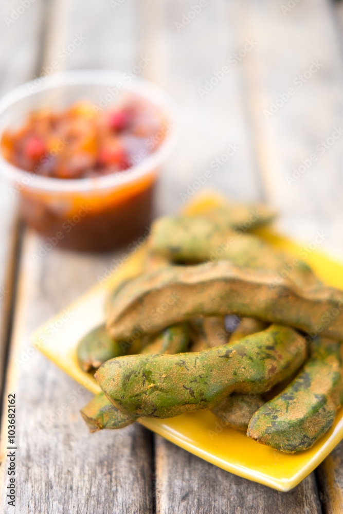 Fresh Tamarind on wood table - selective focus Fresh Tamarind on wood table - selective focus