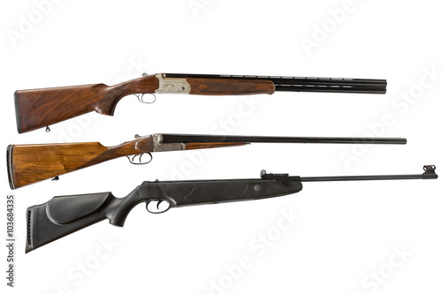 double-barreled shotguns and air gun isolated on white background photo