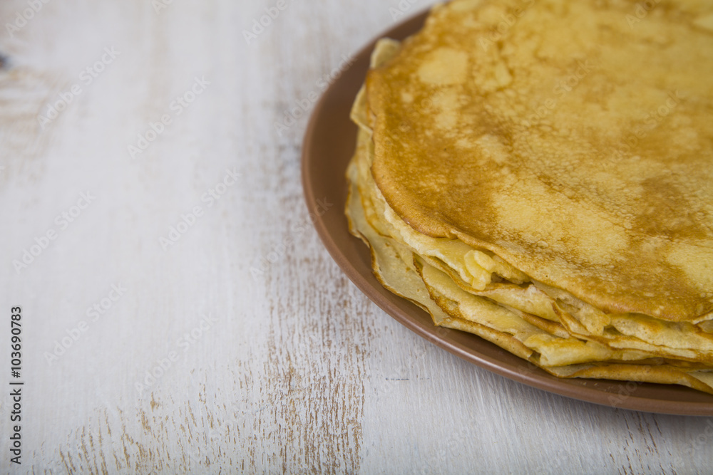 Pancakes on a table. Shrovetide. Pancakes on a table. Shrovetide.