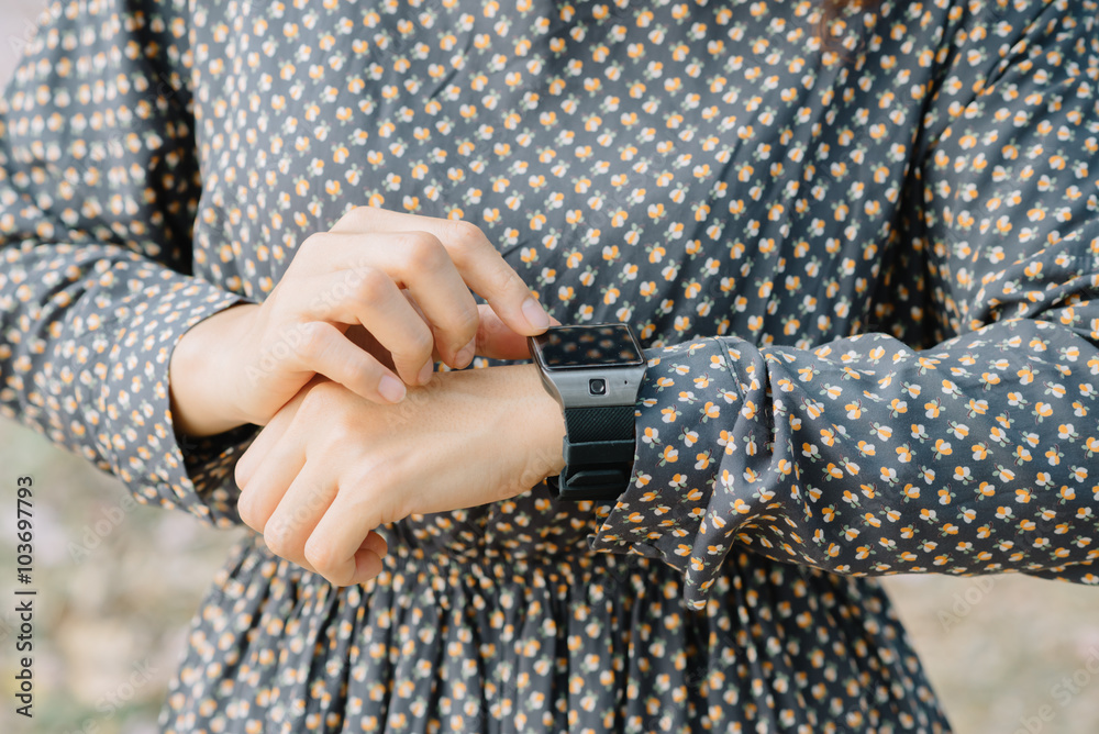 Closeup of woman hands wearing smart watch