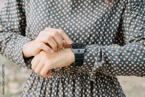 Closeup of woman hands wearing smart watch