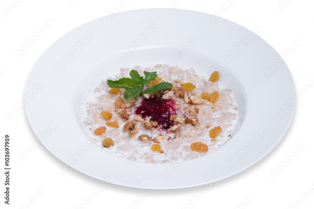 Oatmeal with raisins and walnuts, isolated with clipping path Oatmeal with raisins and walnuts, isolated with clipping path