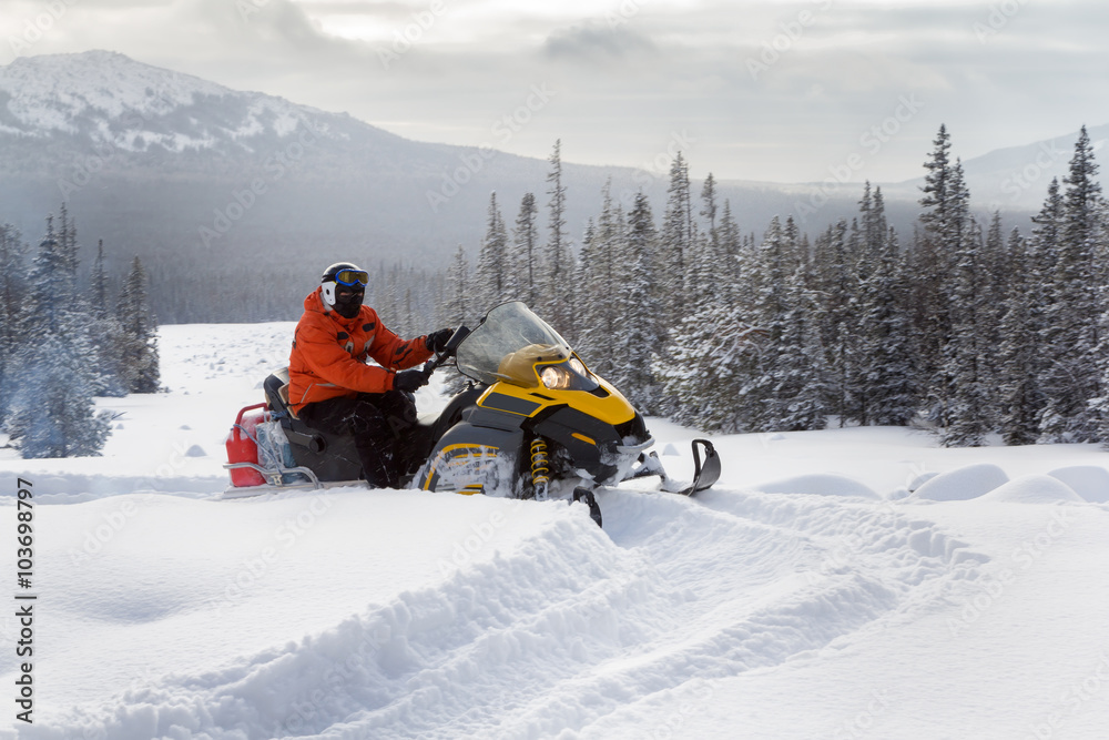 Athlete on a snowmobile.