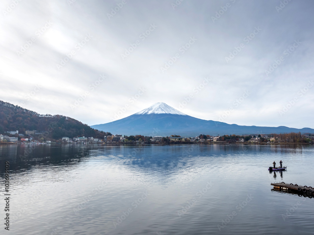 Fuji mountain under cloudy sky with lake
