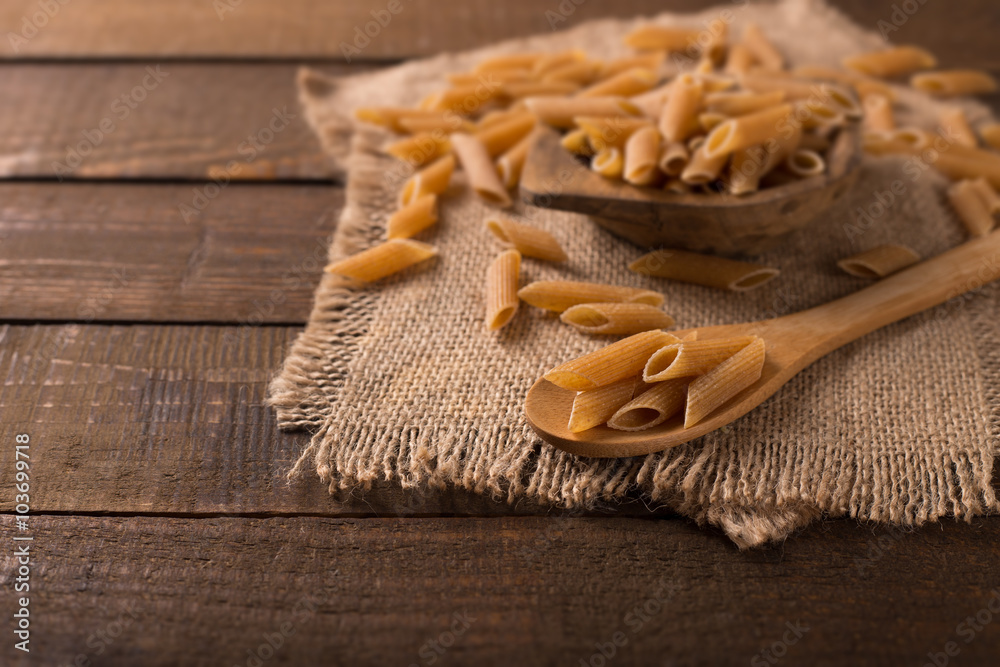 Bowl of penne noodles in rustic style Bowl of penne noodles in rustic style