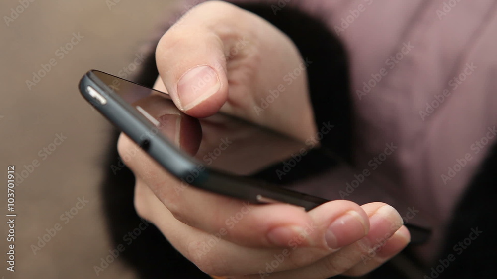 smartphone in female hands outdoors close-up smartphone in female hands outdoors close-up